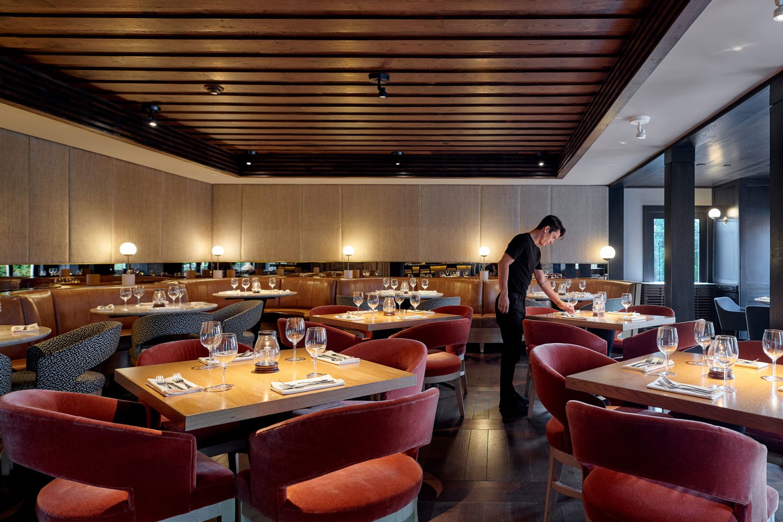 Terrace Room Dining Room View of the Terrace Room dining room with romantic lighting and server arranging tableware