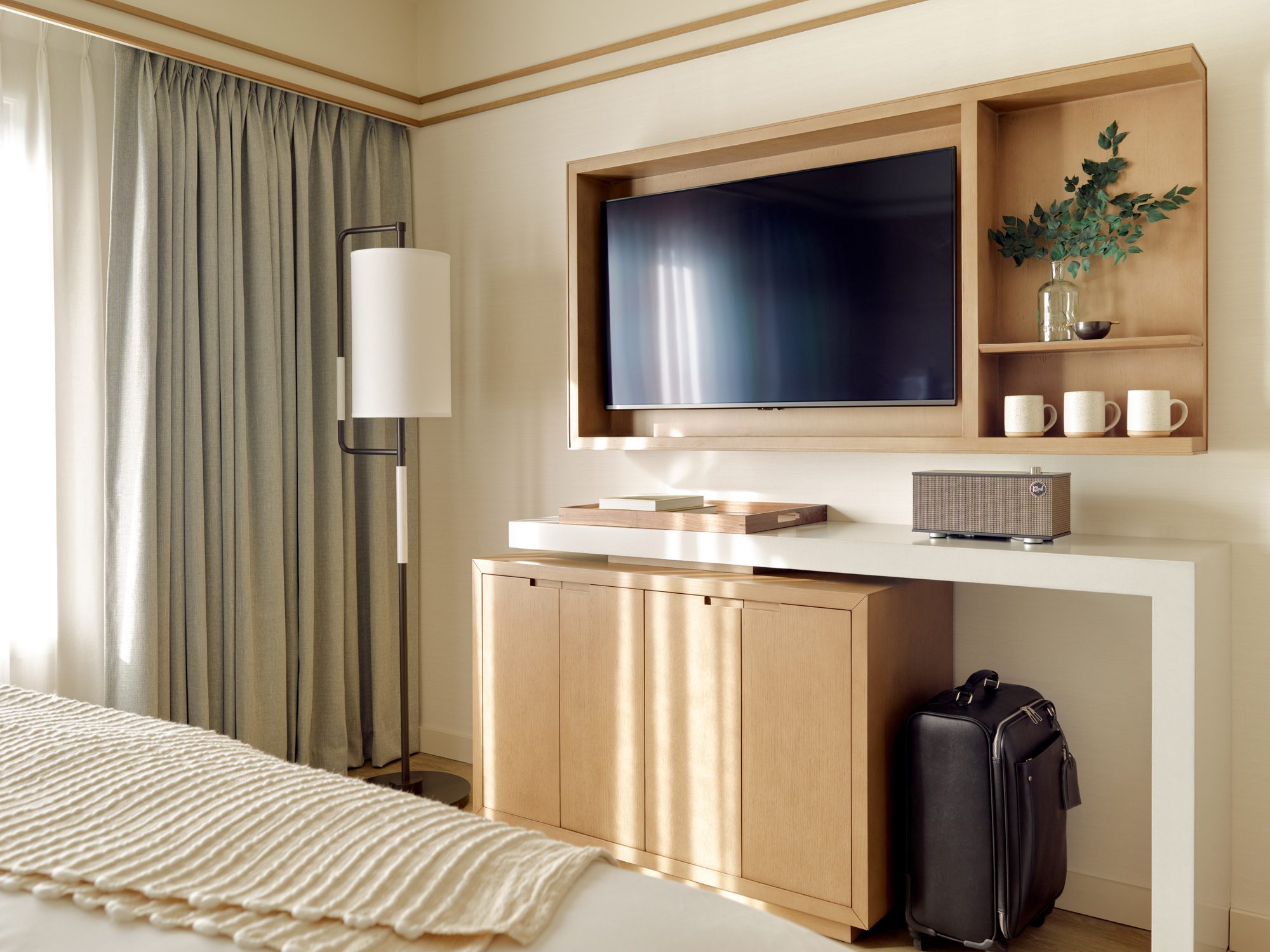 Village View King Suite Bedroom with TV Storage